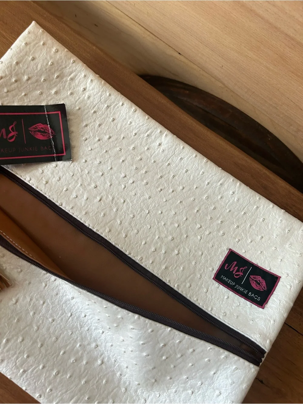 M&J Cream Textured Cosmetic Bag with Tassel